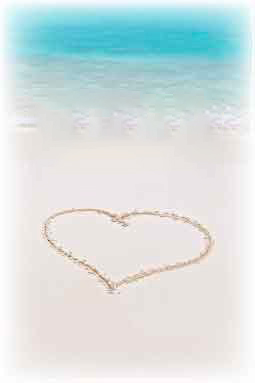 Tackkort med hjärta ritat i sanden